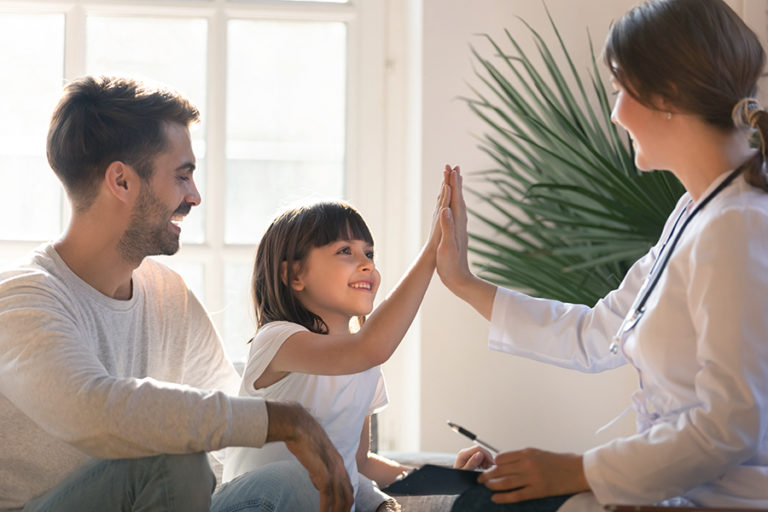 Healthy happy child girl giving high five to female caring doctor celebrate good checkup medical result recovery visiting pediatrist in hospital, pediatrician with kid patient good relationship trust