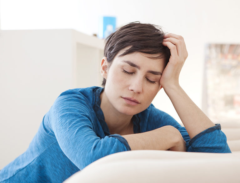 woman feeling fatigued and tired due to hormonal changes